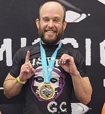 Sawyer Buttweiler with a Submission Challenge medal